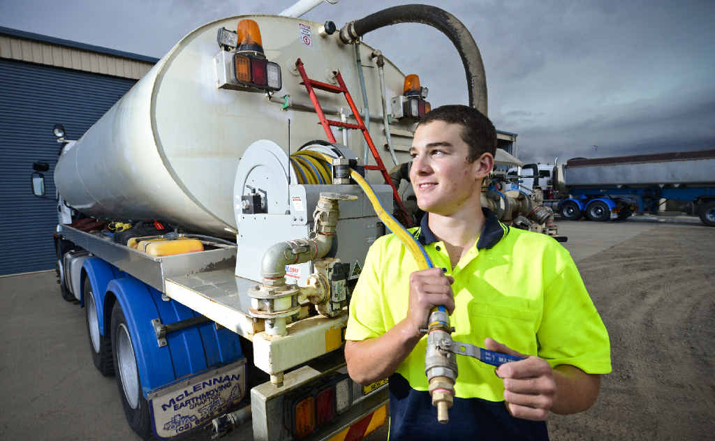 Driver Sam McLennan, of McLennan Earthmoving, with one of the water carriers, and (inset) the storm front moving in on Monday. Driver Sam McLennan, of McLennan Earthmoving, with one of the water carriers, and (inset) the storm front moving in on Monday.