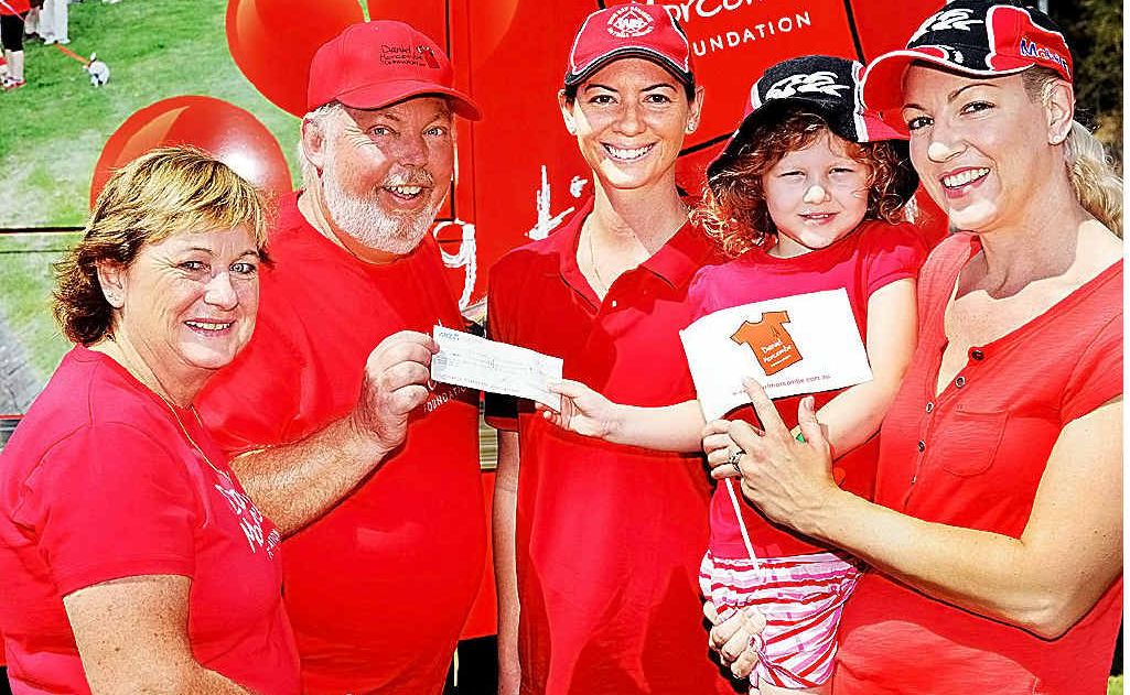 Denise and Bruce Morcombe receive the proceeds from the Police Charity Ball, a cheque for $11,869.86 from Kelly Miles and Indi and Melonie Guild. Denise and Bruce Morcombe receive the proceeds from the Police Charity Ball, a cheque for $11,869.86 from Kelly Miles and Indi and Melonie Guild.