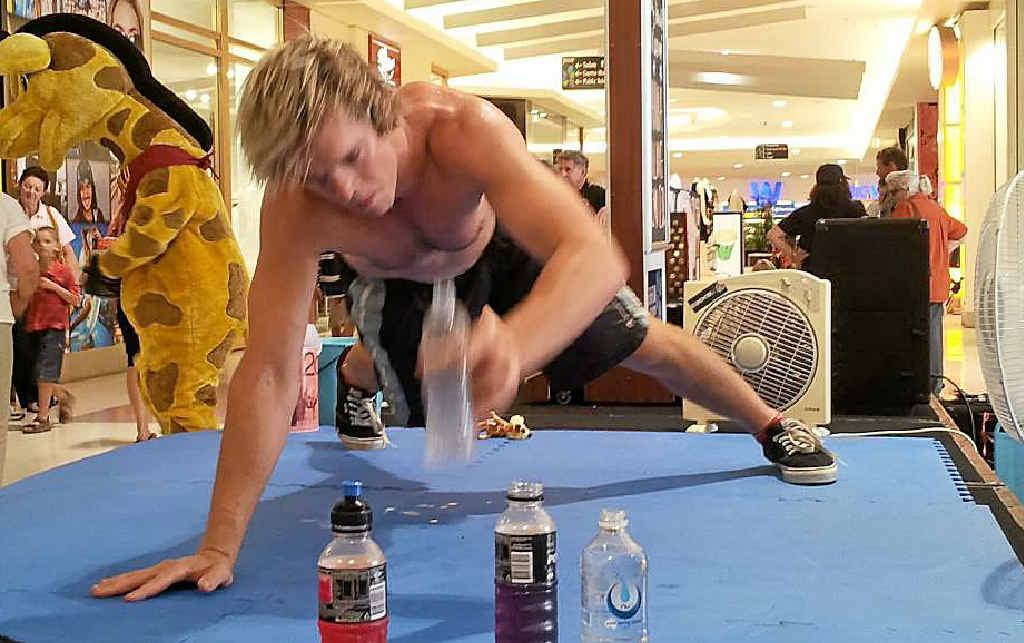 John Causley takes in sustenance on the way to setting his new PB of 1200 single-arm push-ups. John Causley takes in sustenance on the way to setting his new PB of 1200 single-arm push-ups.