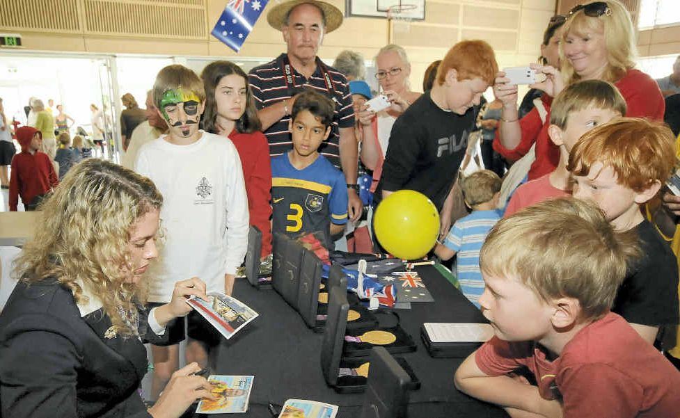 WELCOME HOME: Skennars Head Paralympian Jacqueline Freney meets fans at Lennox Head on Tuesday. WELCOME HOME: Skennars Head Paralympian Jacqueline Freney meets fans at Lennox Head on Tuesday.