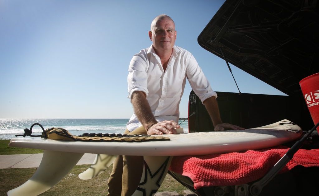 Scoot's surfing general manager Darren Wright waxing up for a before work at Duranbah. Scoot's surfing general manager Darren Wright waxing up for a before work at Duranbah.