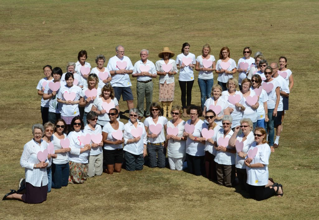 Local women and supporters gathered at Geogg Watt oval to form the shape of a pink ribbon. Local women and supporters gathered at Geogg Watt oval to form the shape of a pink ribbon.