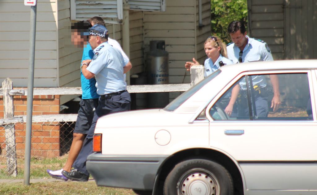 Police officers arrest the young male suspect after a foot chase through Warwick. Police officers arrest the young male suspect after a foot chase through Warwick.