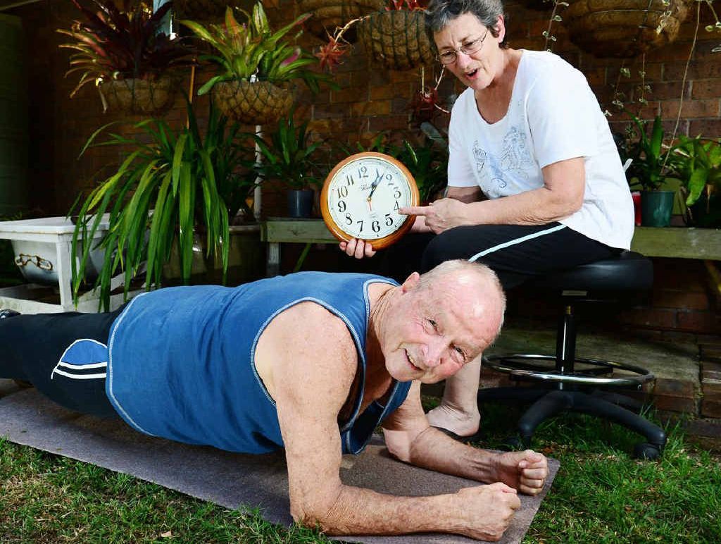 AMAZING FEAT: Doug Fenwick, 81, shows his record-breaking planking form to his wife Chris. AMAZING FEAT: Doug Fenwick, 81, shows his record-breaking planking form to his wife Chris.