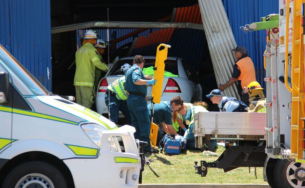 Paramedics work on male driver who crashed his car into the Beaurepaires workshop. Paramedics work on male driver who crashed his car into the Beaurepaires workshop.