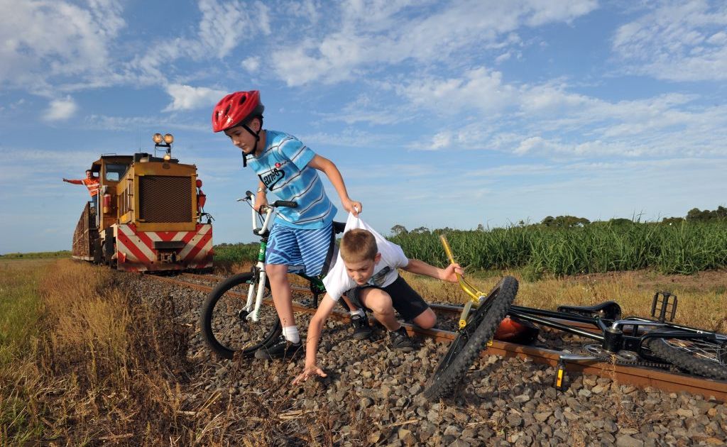CLOSE CALL: Bundaberg Sugar are reminding parents to make sure their kids are not playing near cane railway tracks as this year's crushing season has been extended. Austin and Duncan Allen helped to illustrate the dangers in a photo set up by Bundaberg Sugar and the NewsMail. Photo: Max Fleet / NewsMail CLOSE CALL: Bundaberg Sugar are reminding parents to make sure their kids are not playing near cane railway tracks as this year's crushing season has been extended. Austin and Duncan Allen helped to illustrate the dangers in a photo set up by Bundaberg Sugar and the NewsMail. Photo: Max Fleet / NewsMail