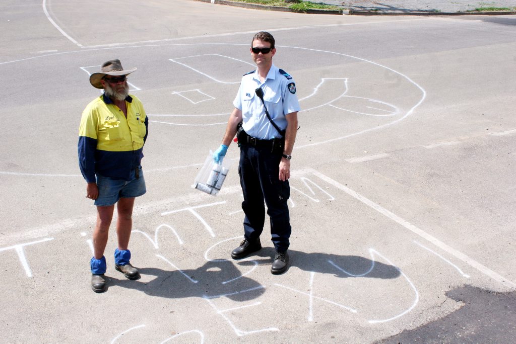 NOT HAPPY: Banana Shire Council worker Lyal Dowrick and Biloela Police Senior Constable Steve Van Der Poel view the graffiti that appeared on Biloela streets in late October. NOT HAPPY: Banana Shire Council worker Lyal Dowrick and Biloela Police Senior Constable Steve Van Der Poel view the graffiti that appeared on Biloela streets in late October.