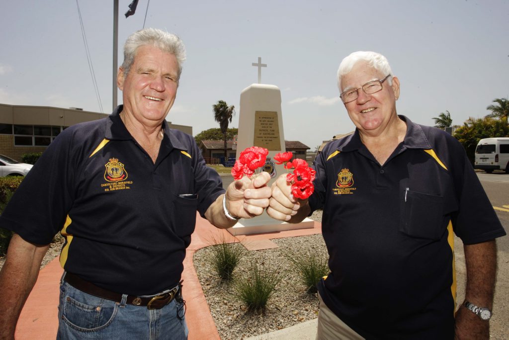 Caboolture RSL sub-branch members Glenn Willmann and Bruce Miller hold up poppies in remembrance. Caboolture RSL sub-branch members Glenn Willmann and Bruce Miller hold up poppies in remembrance.
