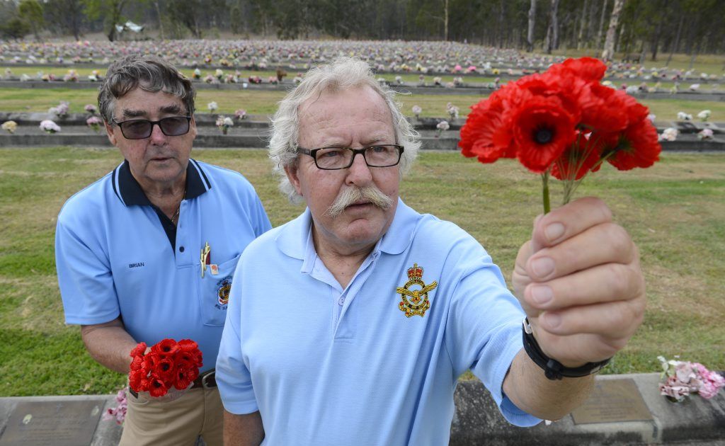 Brian Bultitude and Gerald Niland lay poppies in preperation for Remembranch Day at the lawn cemetary Photo Adam Hourigan / The Daily Examiner Brian Bultitude and Gerald Niland lay poppies in preperation for Remembranch Day at the lawn cemetary Photo Adam Hourigan / The Daily Examiner