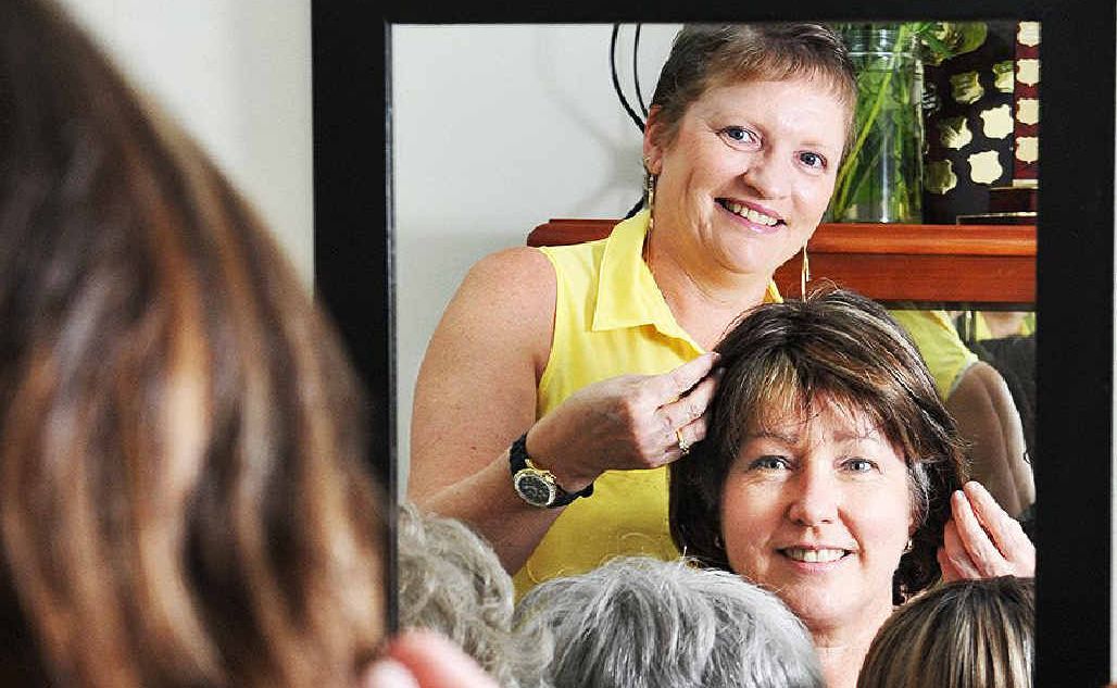 NEW LOOK: Tracy Koroleff, with ex-borrower Elizabeth Spearritt, tries out wigs at the wig library. NEW LOOK: Tracy Koroleff, with ex-borrower Elizabeth Spearritt, tries out wigs at the wig library.
