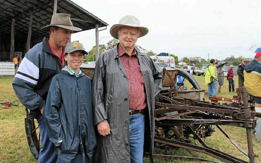 (From left) Kerry, Chris and John O’Mara with their new shearer combine at the Woodcutters clearance sale on Saturday. (From left) Kerry, Chris and John O’Mara with their new shearer combine at the Woodcutters clearance sale on Saturday.