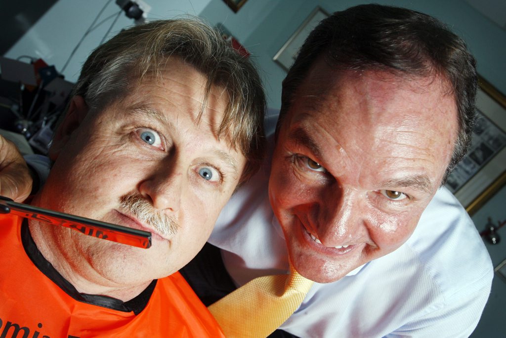 A moustached Queensland Times Sports Editor David Lems comes in for some close attention from Ipswich Mayor Paul Pisasale. A moustached Queensland Times Sports Editor David Lems comes in for some close attention from Ipswich Mayor Paul Pisasale.