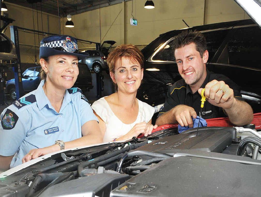 UNDER THE HOOD: Senior Constable Kerrin Sheedy, motorist Sophie Dowe and mechanic Matt Crook run through some basic car maintenance tips ahead of the program to be held at Ian Boettcher Mazda. UNDER THE HOOD: Senior Constable Kerrin Sheedy, motorist Sophie Dowe and mechanic Matt Crook run through some basic car maintenance tips ahead of the program to be held at Ian Boettcher Mazda.