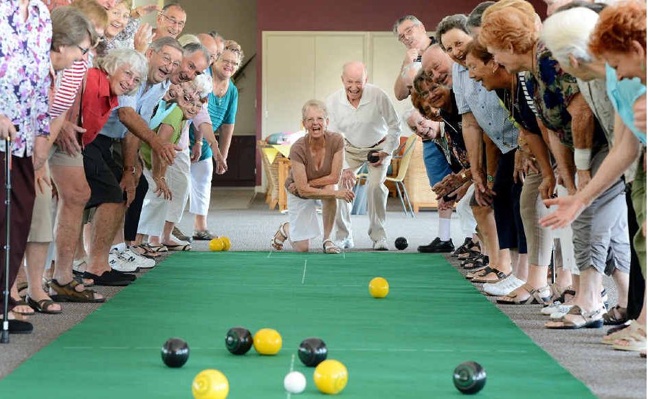 HAPPY DAYS: Residents watch Margaret Lohman and Jim Bolger play indoor bowls on the new mats donated to Bremer Waters. HAPPY DAYS: Residents watch Margaret Lohman and Jim Bolger play indoor bowls on the new mats donated to Bremer Waters.