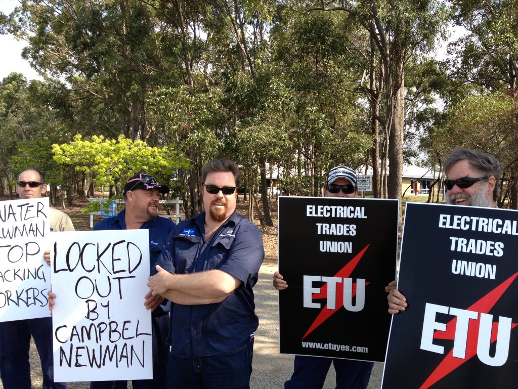 PROTEST: Eletrical Trades Union delegate Scott Reichman with demonstrators outside the Sunwater offices in Enterprise St on Tuesday. Photo Christina Ongley / NewsMail PROTEST: Eletrical Trades Union delegate Scott Reichman with demonstrators outside the Sunwater offices in Enterprise St on Tuesday. Photo Christina Ongley / NewsMail