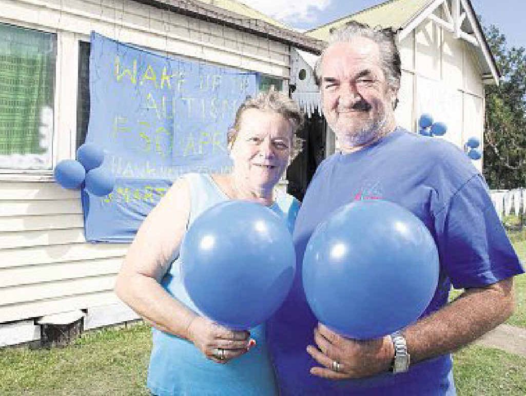 LIGHTING IT UP: David and Dianne Collins in front of their house. INSET: Luke Lockie. LIGHTING IT UP: David and Dianne Collins in front of their house. INSET: Luke Lockie.