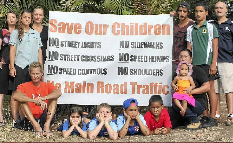 Back row: Waterson Way residents Mandy Coles, Sade and Lisa O’Donnell, Dion Vinci, Stormie Collier and Iyas Shaheen and front row: Sean Oomens, Hannah Shaheen, Asher O’Donnell and Mautoko, Mervyn, Pip and Terri Collier, have concerns for pedestrians along their street which will become a main road under the terms of the Airlie main street upgrade. Back row: Waterson Way residents Mandy Coles, Sade and Lisa O’Donnell, Dion Vinci, Stormie Collier and Iyas Shaheen and front row: Sean Oomens, Hannah Shaheen, Asher O’Donnell and Mautoko, Mervyn, Pip and Terri Collier, have concerns for pedestrians along their street which will become a main road under the terms of the Airlie main street upgrade.