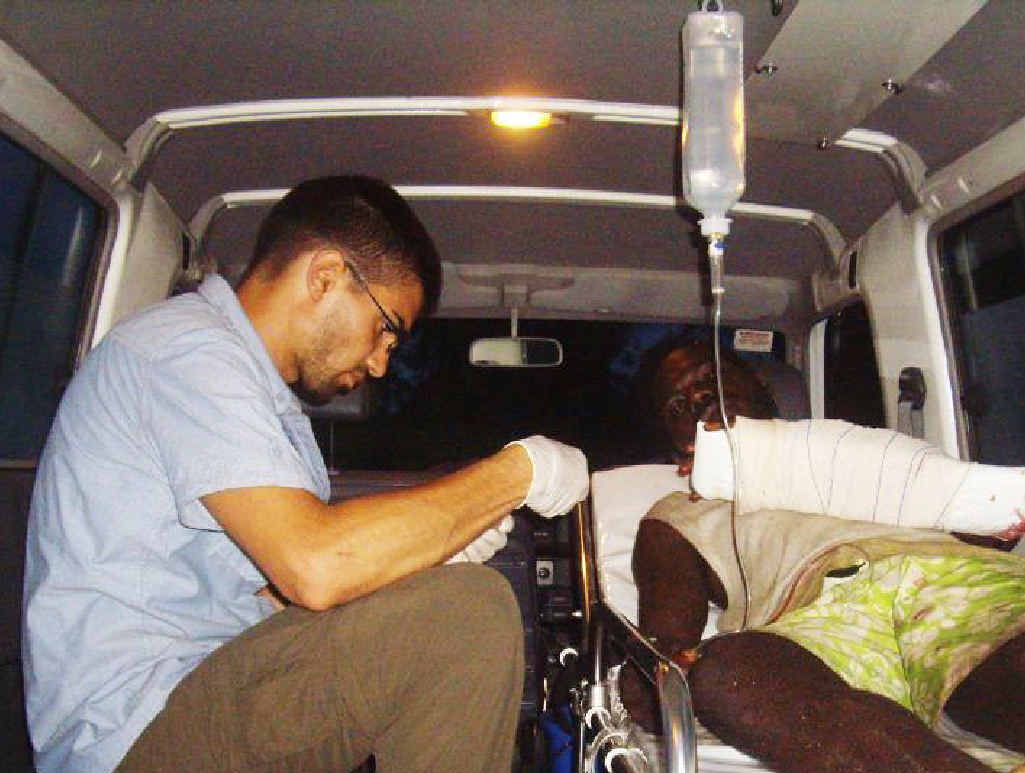MAKESHIFT THEATRE: Dr Nadim Cody treats a man whose arm was badly wounded by a chainsaw. MAKESHIFT THEATRE: Dr Nadim Cody treats a man whose arm was badly wounded by a chainsaw.