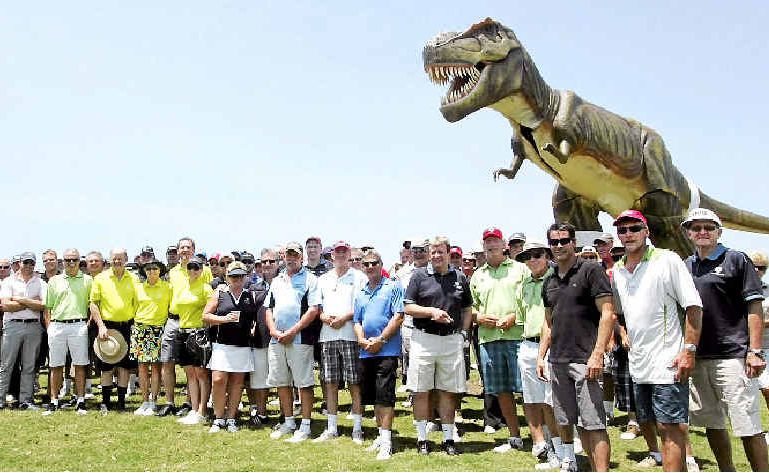 PREHISTORIC SPECTATOR: Golfers at the annual Sunshine Coast Sports Federation golf day meet their new caddy. PREHISTORIC SPECTATOR: Golfers at the annual Sunshine Coast Sports Federation golf day meet their new caddy.