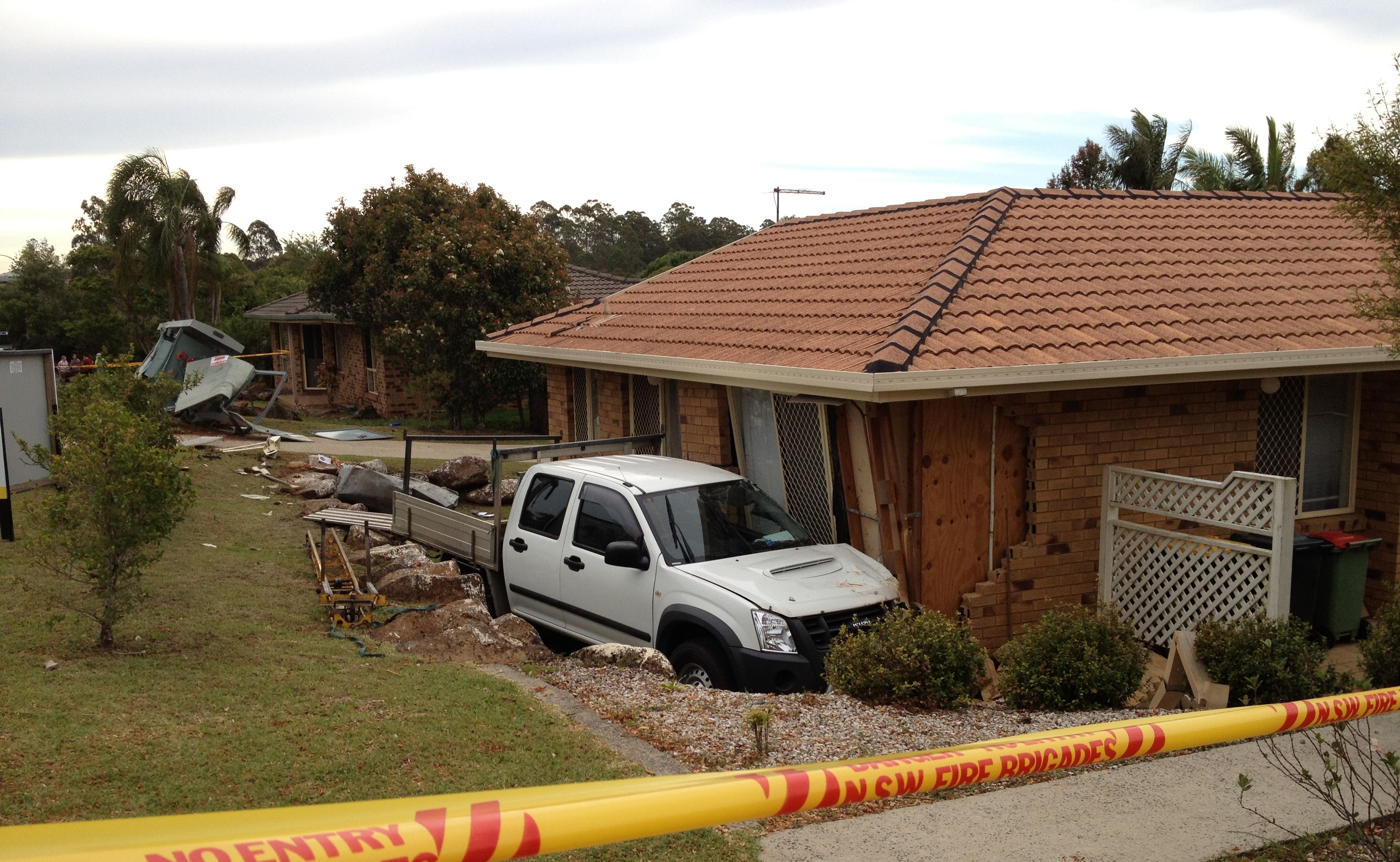 The scene at Oliver Avenue, where a car has knocked down an electrical box before crashing into a house. The scene at Oliver Avenue, where a car has knocked down an electrical box before crashing into a house.