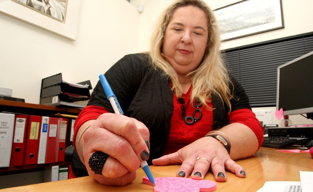 Susi Muddiman doodles at her desk. Photo: Blainey Woodham / Tweed Daily News Susi Muddiman doodles at her desk. Photo: Blainey Woodham / Tweed Daily News