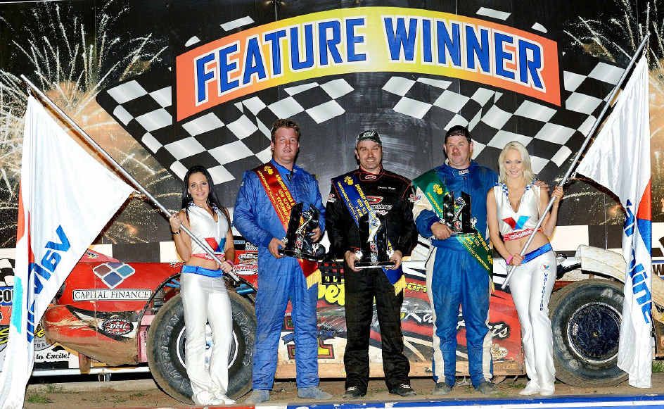 PRIZE POSITION: Ipswich driver Darren Kane (middle) is flanked by NSW championships placegetters Lachlan Onley (left) and Dave Gartner after his latest title success. PRIZE POSITION: Ipswich driver Darren Kane (middle) is flanked by NSW championships placegetters Lachlan Onley (left) and Dave Gartner after his latest title success.