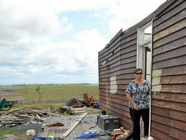 STORM DEVASTATION: Sue Haynes stands in the doorway of the farmhouse rented by her daughter. The place is unliveable, after the roof was blown off in a recent storm. STORM DEVASTATION: Sue Haynes stands in the doorway of the farmhouse rented by her daughter. The place is unliveable, after the roof was blown off in a recent storm.