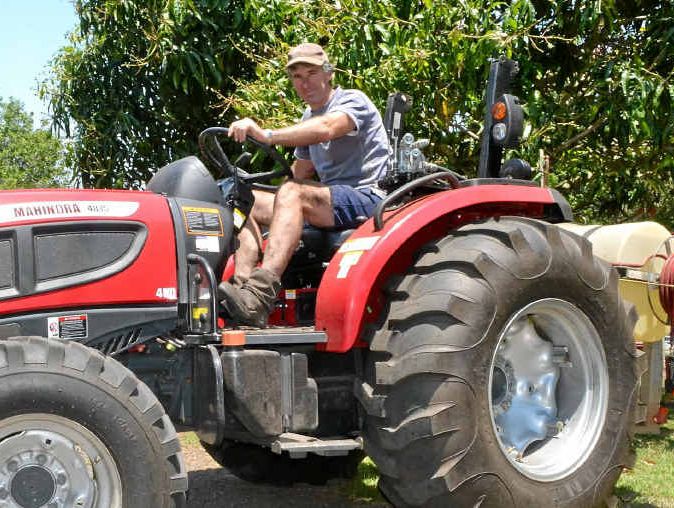 BE PREPARED: Macadamia farmer Greg Bennett on the tractor he used to help the Rural Fire Service put out spot fires. BE PREPARED: Macadamia farmer Greg Bennett on the tractor he used to help the Rural Fire Service put out spot fires.