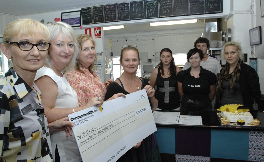Commonwealth Bank customer service manager Fiona Montgomery and branch manager Julie Magner present YWCA senior manager Johnny Iuso with a cehck for the YWCA Pulse Cafe in Lismore. Photo Marc Stapelberg / The Northern Star Commonwealth Bank customer service manager Fiona Montgomery and branch manager Julie Magner present YWCA senior manager Johnny Iuso with a cehck for the YWCA Pulse Cafe in Lismore. Photo Marc Stapelberg / The Northern Star
