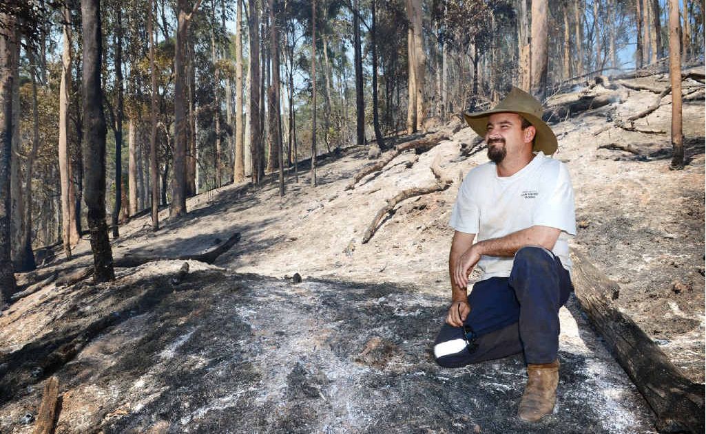 Mark Grennan on his burnt property at Goomboorian yesterday. Mark Grennan on his burnt property at Goomboorian yesterday.