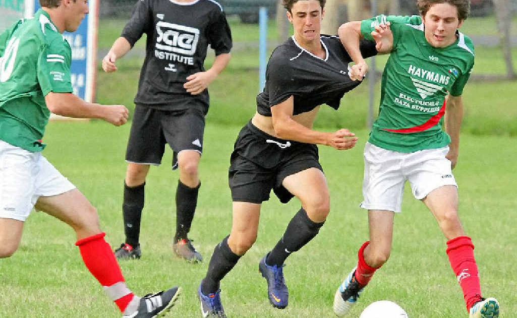 DEFENCE STRETCHED: An Italo Stars defender tries the shirt tackle. DEFENCE STRETCHED: An Italo Stars defender tries the shirt tackle.