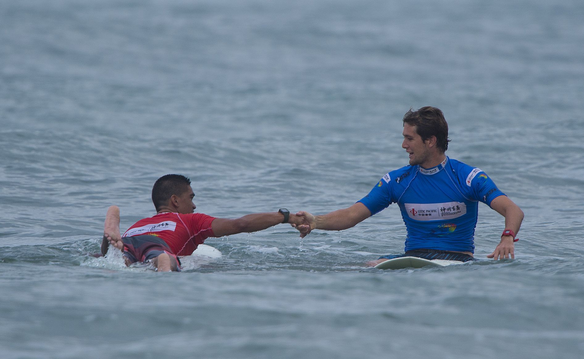 Harley Ingleby in blue congratulates Hawaii's Nelson Ahina after Ingleby was defated in the quarter finals of the ASP World Longboard Titles. Harley Ingleby in blue congratulates Hawaii's Nelson Ahina after Ingleby was defated in the quarter finals of the ASP World Longboard Titles.