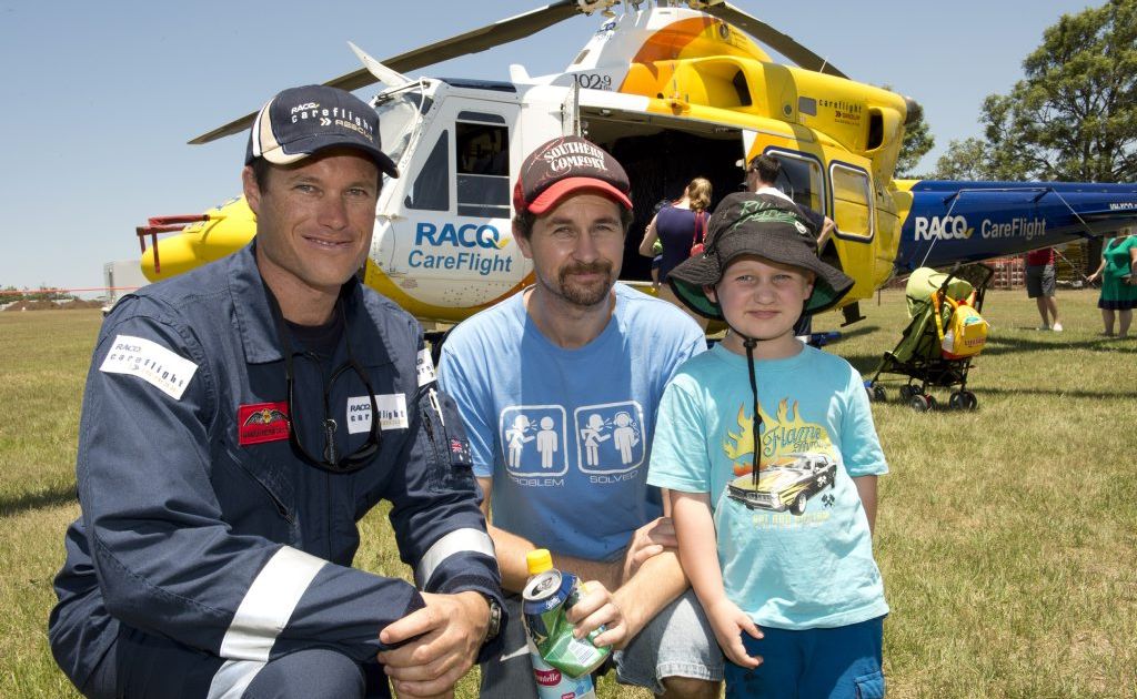(from left) CareFlight pilot Hamish Felton-Taylor with Anthony powderly and son Cristian. RACQ Careflight hangar opening. Photo Nev Madsen / The Chronicle (from left) CareFlight pilot Hamish Felton-Taylor with Anthony powderly and son Cristian. RACQ Careflight hangar opening. Photo Nev Madsen / The Chronicle