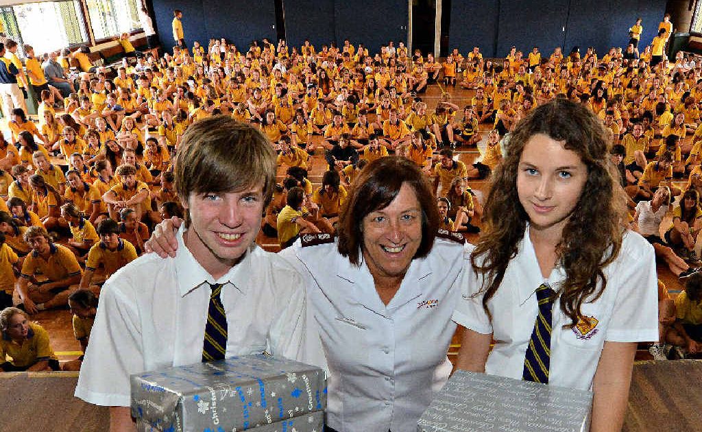 GREAT WORK: North Bundaberg High School’s Jack Ford and Rachel Bridges present Christmas hampers to the Salvation Army’s Major Heather Unicomb as part of the Mayor’s Christmas appeal. GREAT WORK: North Bundaberg High School’s Jack Ford and Rachel Bridges present Christmas hampers to the Salvation Army’s Major Heather Unicomb as part of the Mayor’s Christmas appeal.