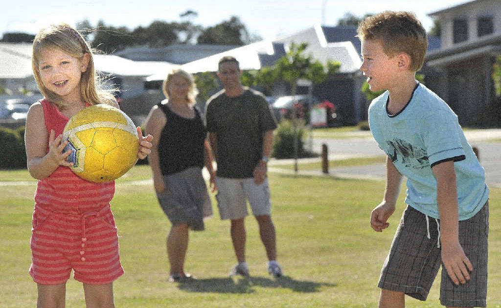 From left, Summer (5) and Reid (7) Thompson testing their ball skills. (at the back mum and dad : LTR Tina and Craig Thompson) of East Ballina. Photo Mireille Merlet-Shaw / The Northern Star From left, Summer (5) and Reid (7) Thompson testing their ball skills. (at the back mum and dad : LTR Tina and Craig Thompson) of East Ballina. Photo Mireille Merlet-Shaw / The Northern Star