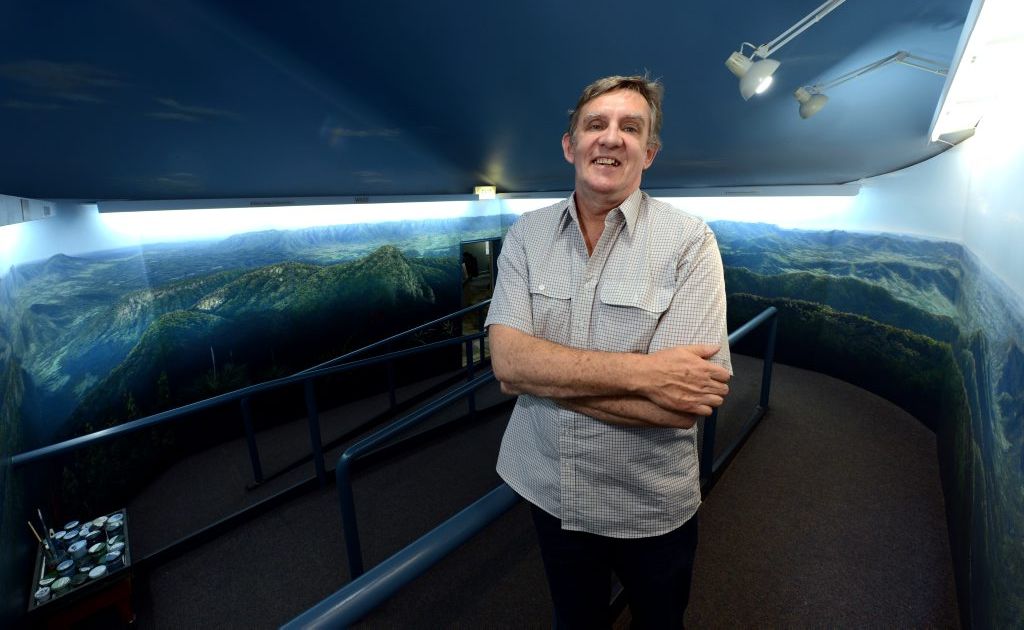 Andy Reimanis with the finished mural at Murwillumbah visitor centre. Photo: John Gass / Daily News Andy Reimanis with the finished mural at Murwillumbah visitor centre. Photo: John Gass / Daily News