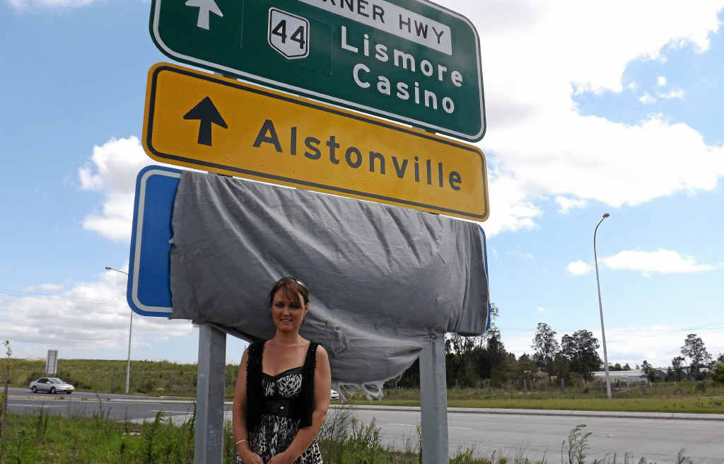 SIGN WELCOMED: Alstonville Chamber of Commerce vice-president Candy Fitness and the new sign for Alstonville. SIGN WELCOMED: Alstonville Chamber of Commerce vice-president Candy Fitness and the new sign for Alstonville.
