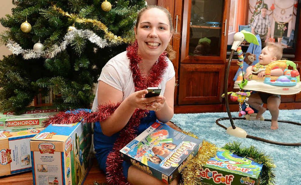 ONLINE SHOPPER: Laura Loveday, pictured with her nine-month-old son Toby, has done all of her Christmas shopping over the internet. Ipswich is one of the most prolific areas for online shopping. ONLINE SHOPPER: Laura Loveday, pictured with her nine-month-old son Toby, has done all of her Christmas shopping over the internet. Ipswich is one of the most prolific areas for online shopping.