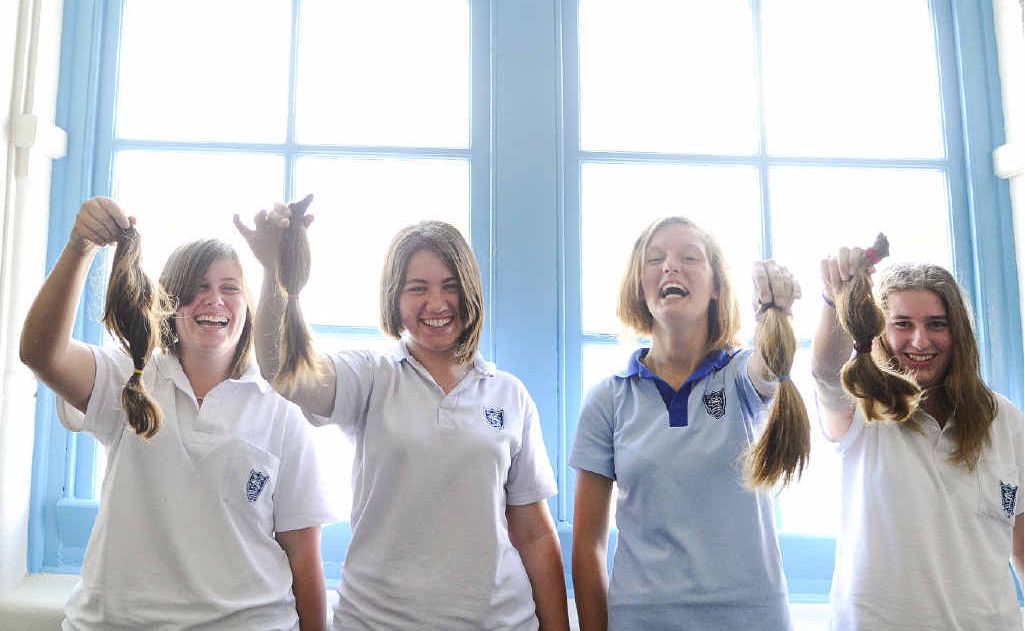 HAIRS TO CHARITY: Samantha Limbert, Krystal King, Acacia Endean and Kate Sneesby had 20 centimetres of hair cut off to make wigs for cancer sufferers. Photo: JoJo Newby HAIRS TO CHARITY: Samantha Limbert, Krystal King, Acacia Endean and Kate Sneesby had 20 centimetres of hair cut off to make wigs for cancer sufferers. Photo: JoJo Newby