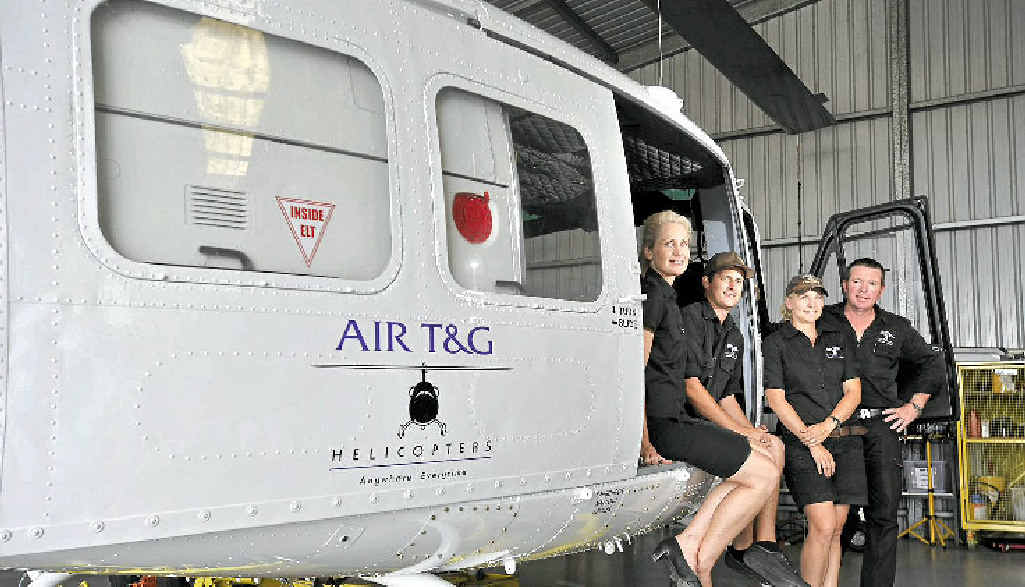 CHOPPER CREW: Sandy McGauley, Wayne McIntosh, Georgie and Tim Latimer of AIR T&G; Ballina, with the new Bell Huey helicopter to fight bushfires and flood relief. CHOPPER CREW: Sandy McGauley, Wayne McIntosh, Georgie and Tim Latimer of AIR T&G; Ballina, with the new Bell Huey helicopter to fight bushfires and flood relief.