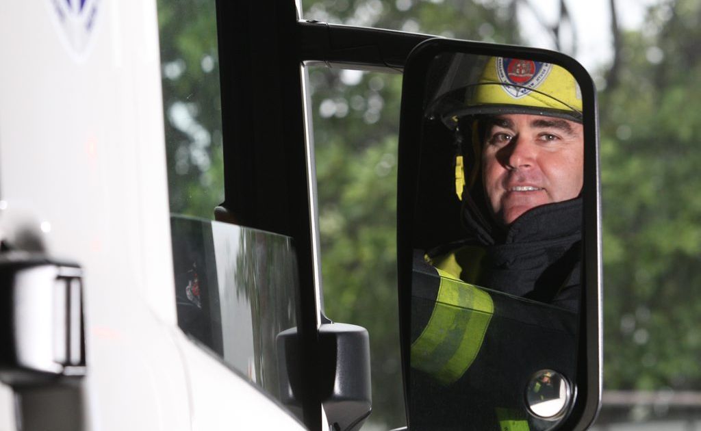 Senior firefighter Jason Recliner checking his mirrors. Photo Blainey Woodham / Daily News Senior firefighter Jason Recliner checking his mirrors. Photo Blainey Woodham / Daily News