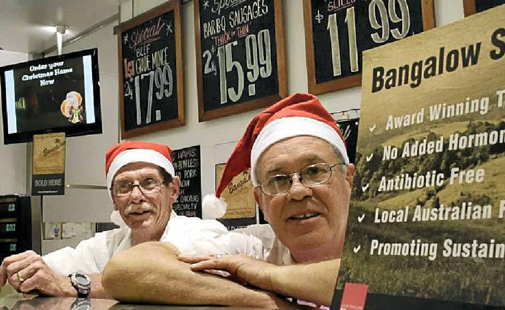 Grafton Shoppingworld butchers Jeff Newsom and Noel Woodcock take a quick break from preparing for the shopping rush. Photo: Kate Matthews Grafton Shoppingworld butchers Jeff Newsom and Noel Woodcock take a quick break from preparing for the shopping rush. Photo: Kate Matthews