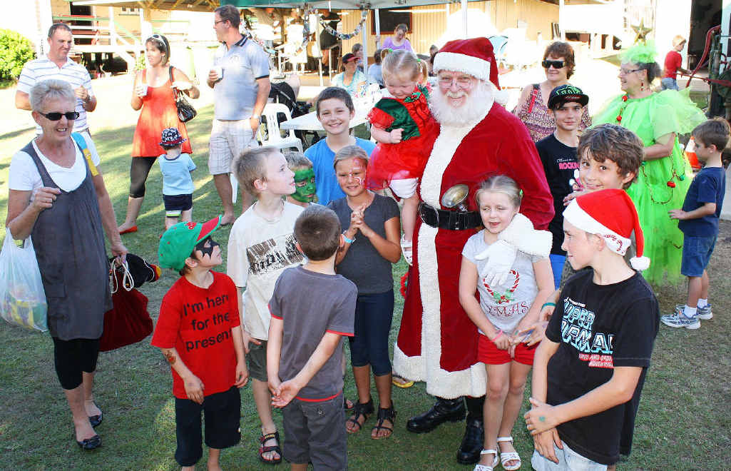 CENTRE OF ATTENTION: Santa Claus arrives all smiles at Laidley’s Pioneer Village and is an instant hit. CENTRE OF ATTENTION: Santa Claus arrives all smiles at Laidley’s Pioneer Village and is an instant hit.