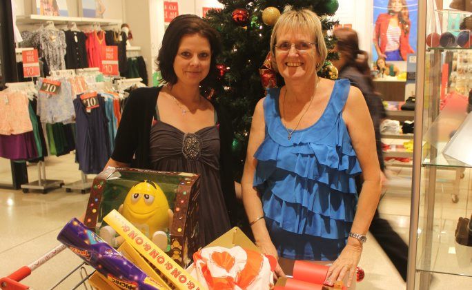 Samantha and Krysteen Dawes had their groceries under control but went shopping for some last minute gifts on Christmas Eve. Photo Kathleen Calderwood / Rural Weekly Samantha and Krysteen Dawes had their groceries under control but went shopping for some last minute gifts on Christmas Eve. Photo Kathleen Calderwood / Rural Weekly