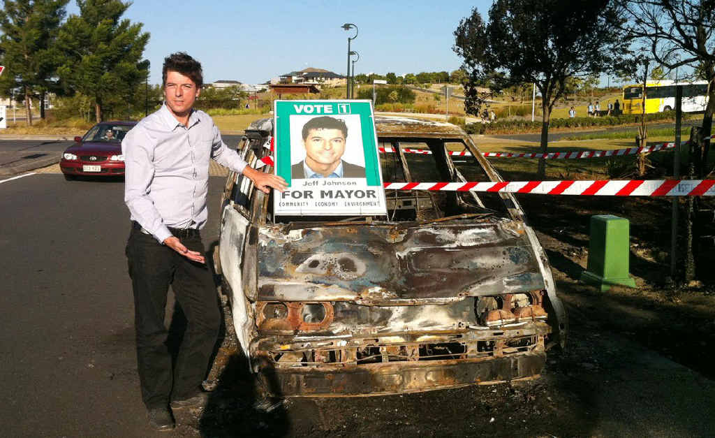 Ballina Greens mayoral candidate jeff Johnson and his campaign van that was stolen on Wednesday night, burnt out and dumped at Pottsville. Photo Contributed Ballina Greens mayoral candidate jeff Johnson and his campaign van that was stolen on Wednesday night, burnt out and dumped at Pottsville. Photo Contributed