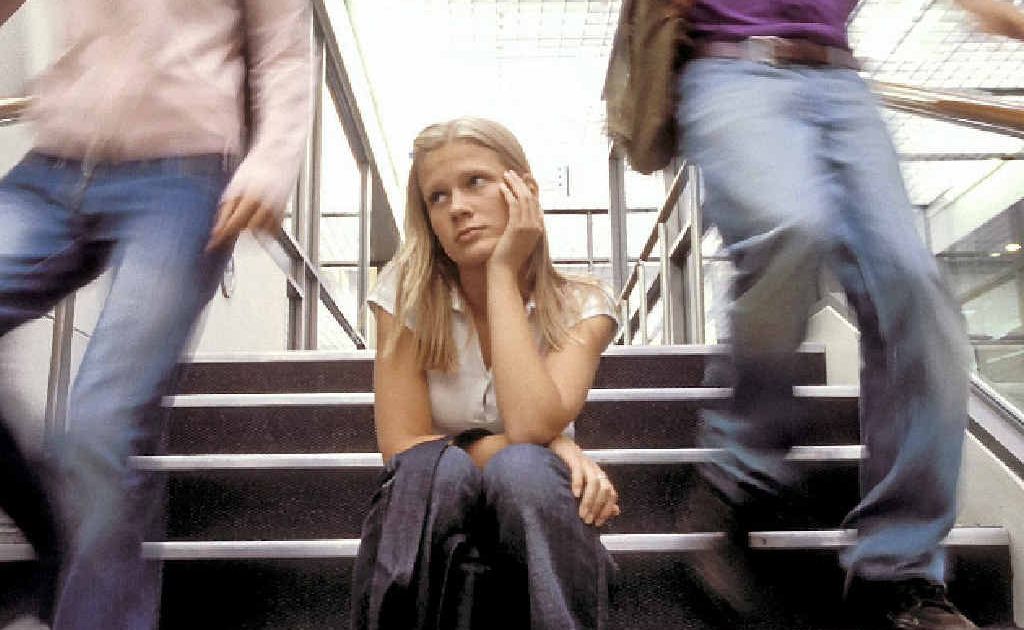 Depressed student in stairwell Depressed student in stairwell