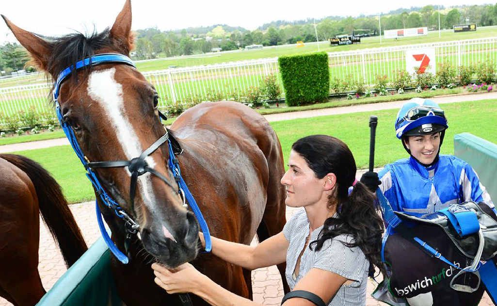 MONEY GRABBER: City of Ipswich Plate winner Grabthemoney’n’run with jockey Tegan Harrison (right). MONEY GRABBER: City of Ipswich Plate winner Grabthemoney’n’run with jockey Tegan Harrison (right).