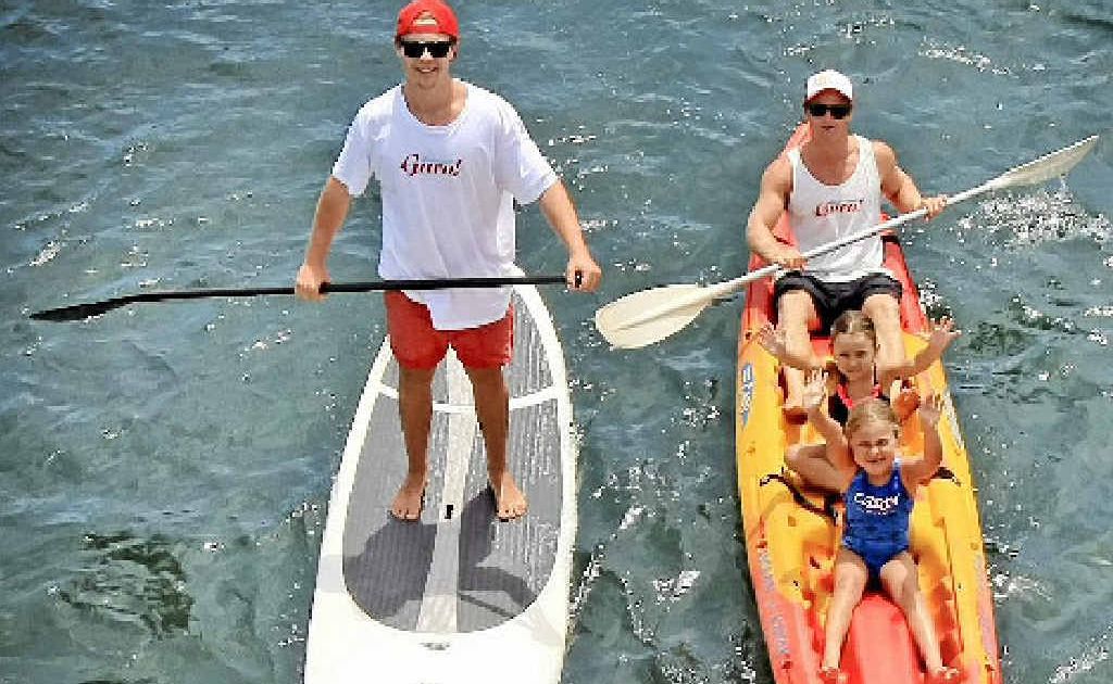 GURUS: Mick Munday takes Kaitlin, 7, and Zoe, 4, McMahon for a kayak while paddleboard expert Dean Kenny tags along. GURUS: Mick Munday takes Kaitlin, 7, and Zoe, 4, McMahon for a kayak while paddleboard expert Dean Kenny tags along.