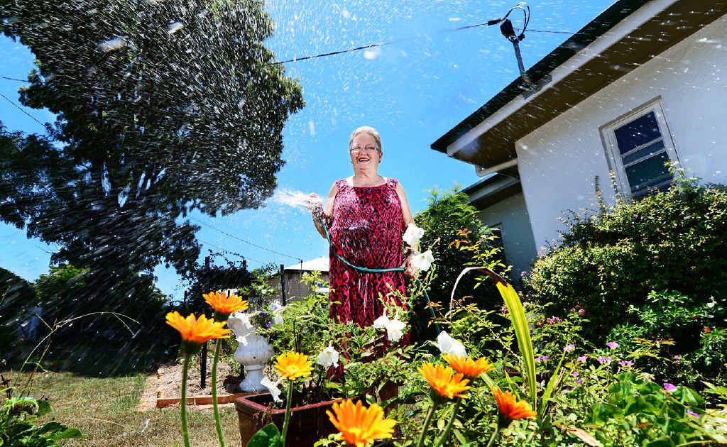 SPLASHING OUT: Ipswich Horticultural Society president Dawn Jones warns of higher costs as water restrictions end. SPLASHING OUT: Ipswich Horticultural Society president Dawn Jones warns of higher costs as water restrictions end.