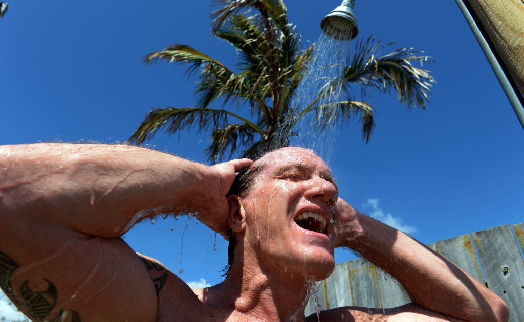 Ray Baxter, of Pottsville, taking a shower at Kingscliff Beach after cooling off in the surf. Ray Baxter, of Pottsville, taking a shower at Kingscliff Beach after cooling off in the surf.
